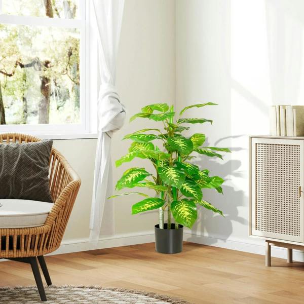 Faux rose plant with pots, green foliage in black pot near window and seating