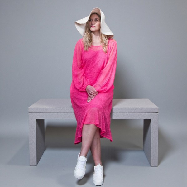 Women's Aphrodite Hot Pink Holiday Resort Dress with a  hot pink undergarment, paired with a white sunhat and white sneakers.