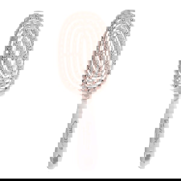 Hairbrush with a unique bristle pattern on a white background, featuring the brand 'Revitalize'.