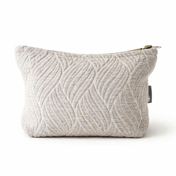 Light gray quilted jacquard toiletry bag with leaf pattern and gold zipper pull
