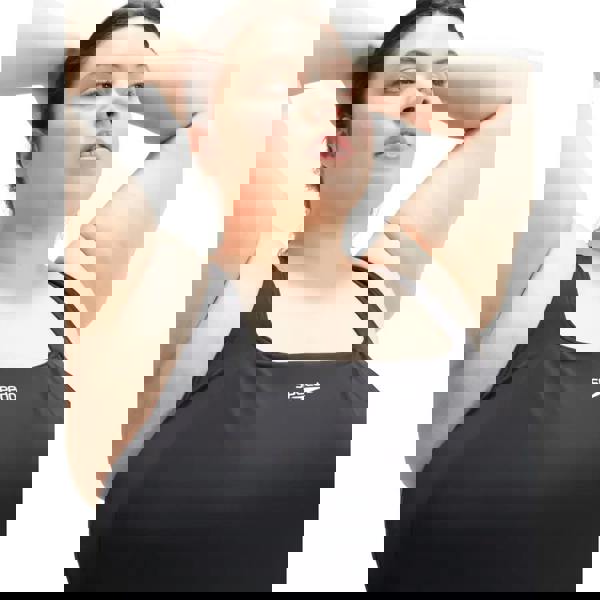 Black plus size Speedo Essential Swim Dress with white logo and thin straps