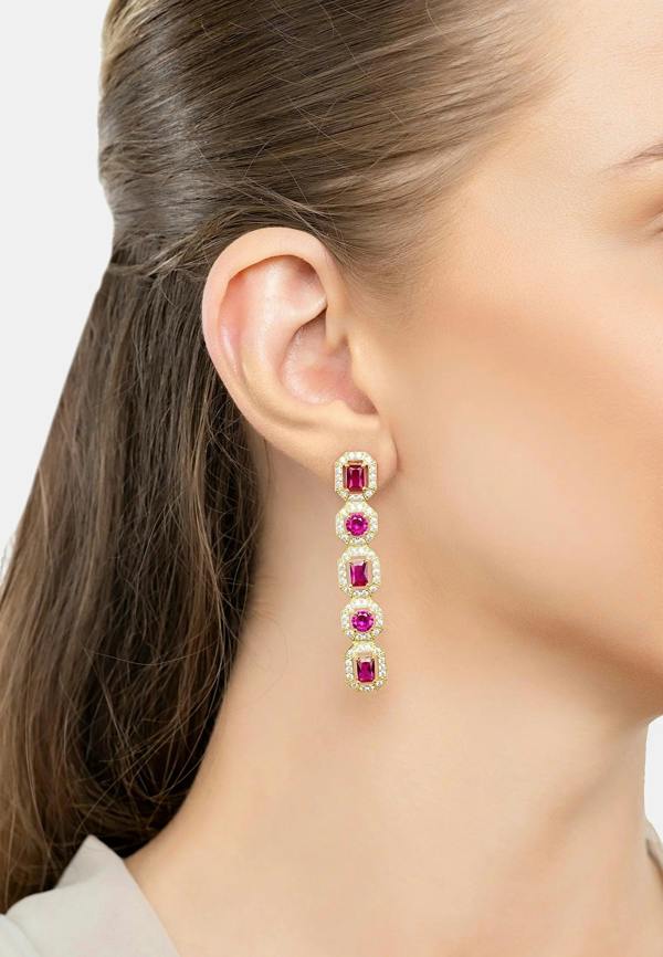 The earring worn by a model.