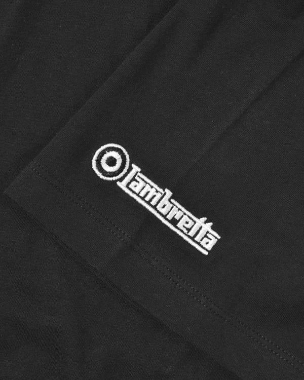 Lambretta Mens Two Tone Stripe Classic Mod Ska Casual Smart T-Shirt, close-up view of the black T-shirt fabric featuring white embroidered Lambretta logo and stripe design.