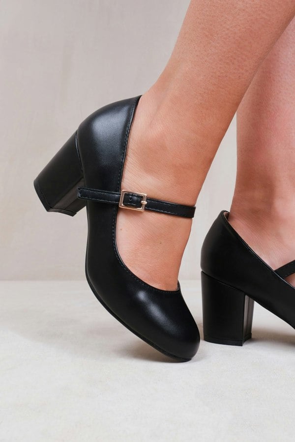 Where's That From Araceli Wide Fit Block Heel Mary Jane Pumps in Black Faux Leather