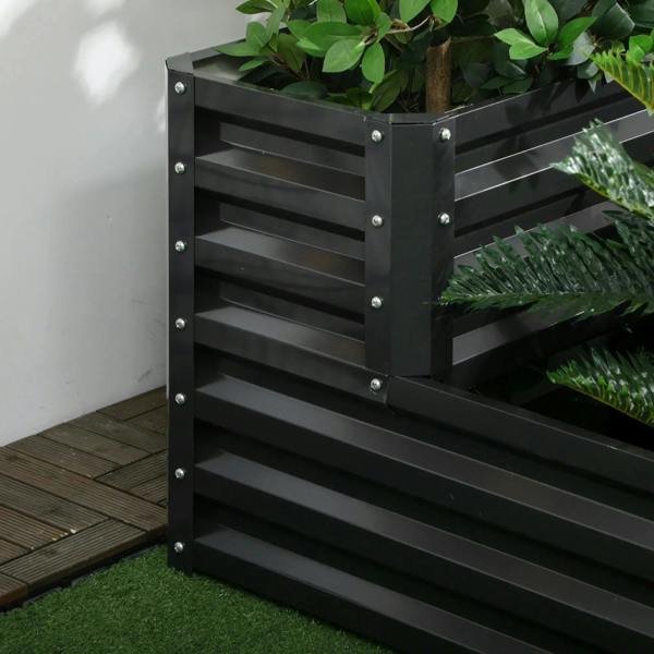 Dark grey two-tier raised planter box side panel with bolts and leafy plants
