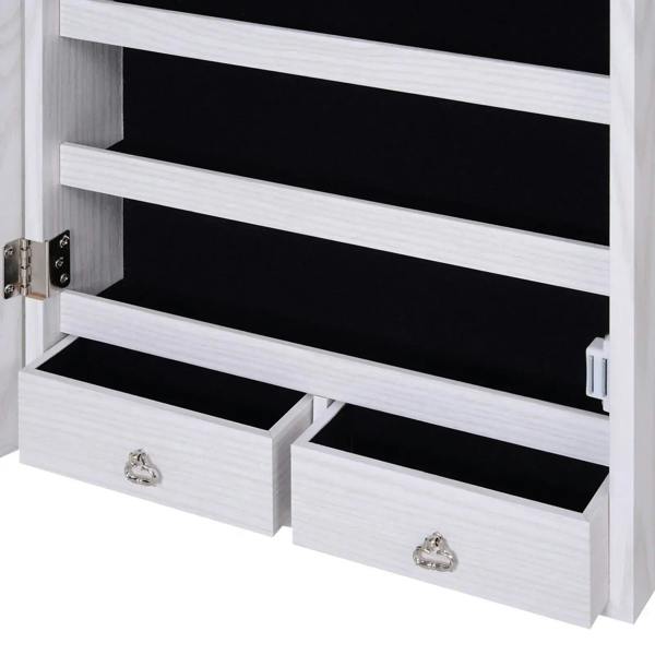 White jewelry cabinet drawer compartments with black shelves and small jewelry tray pulls.