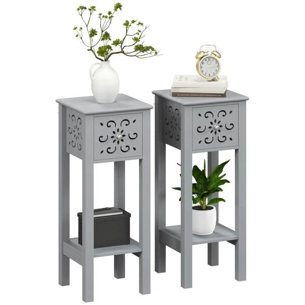 Set of two grey side tables with floral cut-out panels and lower shelf