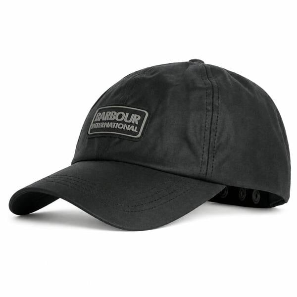 Black Barbour International wax cotton baseball cap with a branded front patch and adjustable snap-back strap.