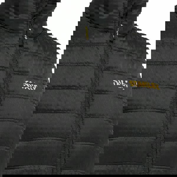 Stanley Banff Mens Ripstop Water Resistant Work Gilet Body Warmer, close-up view of black padded sleeveless vest with yellow Stanley logo and front zipper.