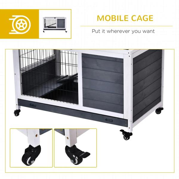Grey wooden guinea pig hutch on caster wheels with wire front and enclosed compartment