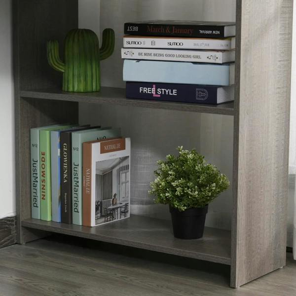 Grey open shelving section of a corner desk, holding books and a small plant