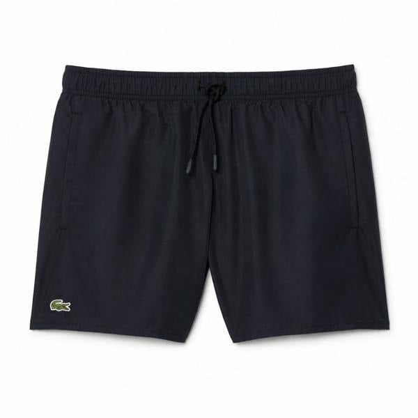 Lacoste black quick-dry swim shorts with drawstring waist and green crocodile logo.
