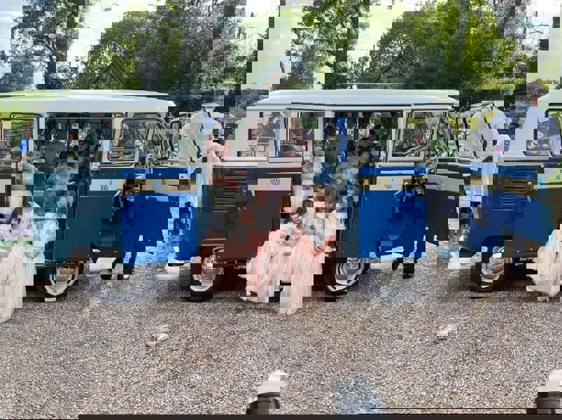 Flower girls and babies in camper van for wedding 