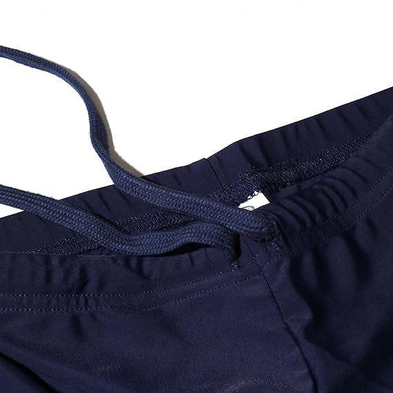Close-up of navy Optimum Multi-X shorts waistband with drawstring, on white - Optimum