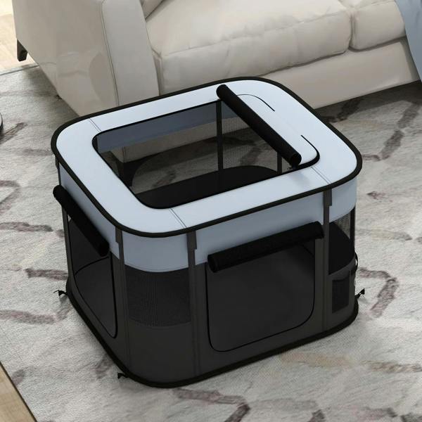 Foldable dog pen viewed from above, grey top frame, mesh walls, rounded front corner