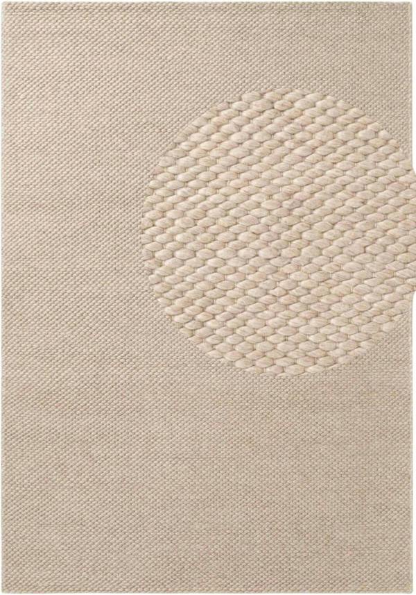 Beige textured rug with a circular pattern