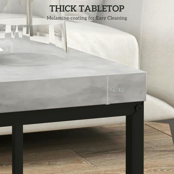 Close-up of grey thick tabletop on a black-framed nesting coffee table