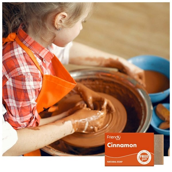 Parent and child using potters wheel