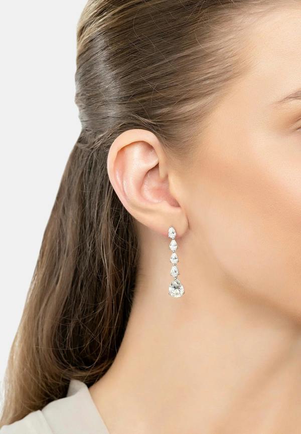 The earring worn by a model.