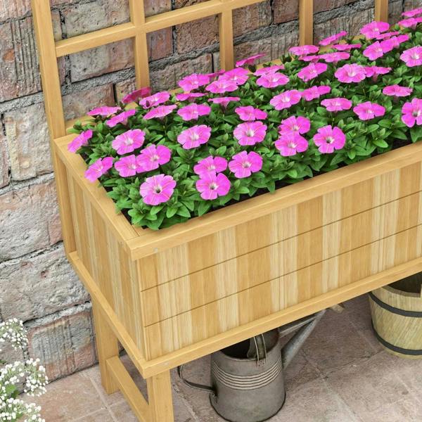 Natural wooden garden planter with trellis, close-up of pink flowering plants.