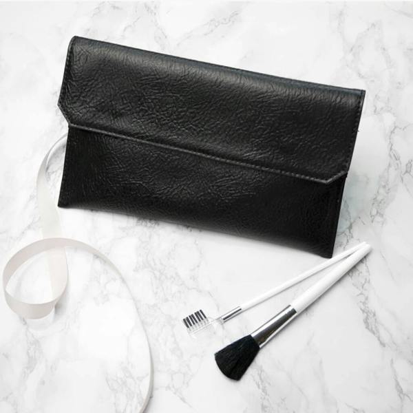 Personalised Black Leather Clutch Bag - product in use