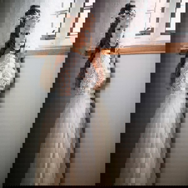 Floor Girl wearing a Flutter Dress in Ivory