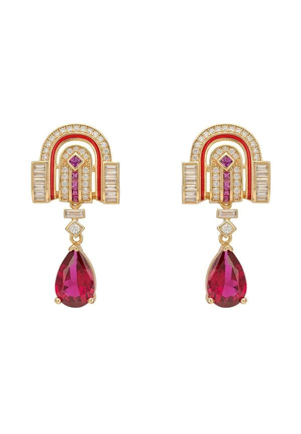 Pair of earrings with red gemstones and gold accents on a white background