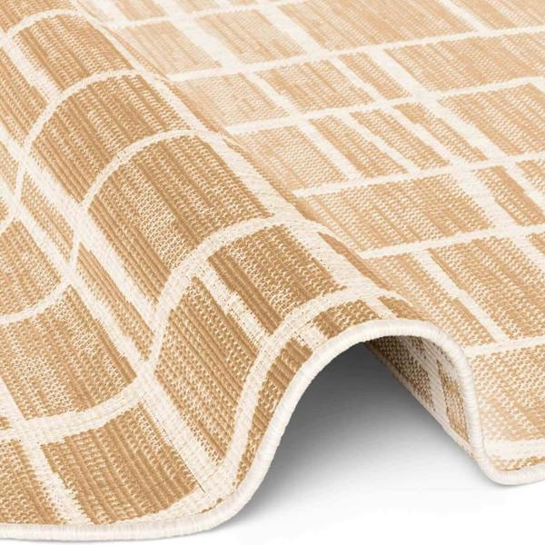 Close-up of a beige and white checkered rug on a plain background