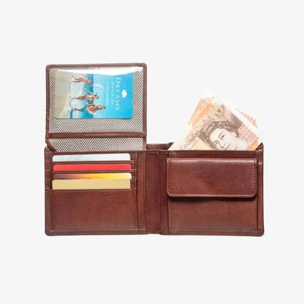 Light Brown leather wallet with various cards and money on a white background