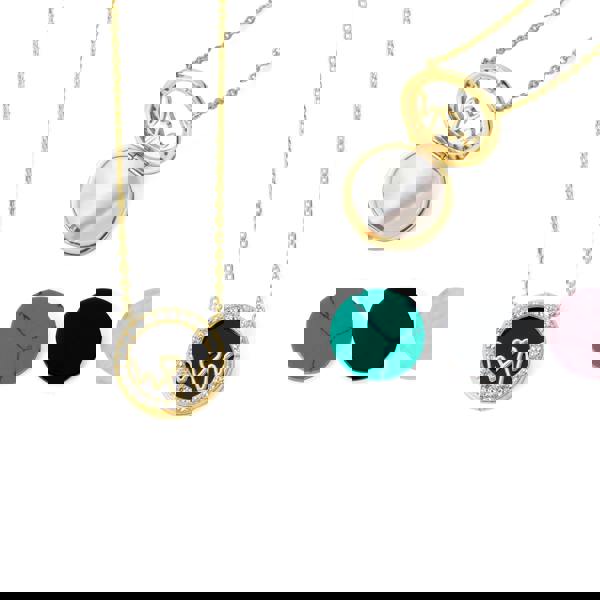 Bloomtine-Loves-Frequency-gold-vermeil-heartbeat-locket. A professional-high-resolution-product-photograph of an-18kt-gold-vermeil-heart-locket on a-crisp-white-background. This-detailed-view showcases the-multiple-shimmering-gemstones meticulously-set-along the-heartbeat-rhythm-path. The-image-highlights the-flawless-polished-finish and the-intricate-symbolic-engraving of the Bloomtine-signature-collection, making it an-exquisite-luxury-gift-choice for sentimental-occasions and milestone-celebratio