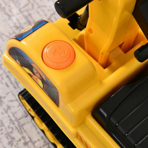 Yellow ride-on excavator toy seat with round orange button and molded console