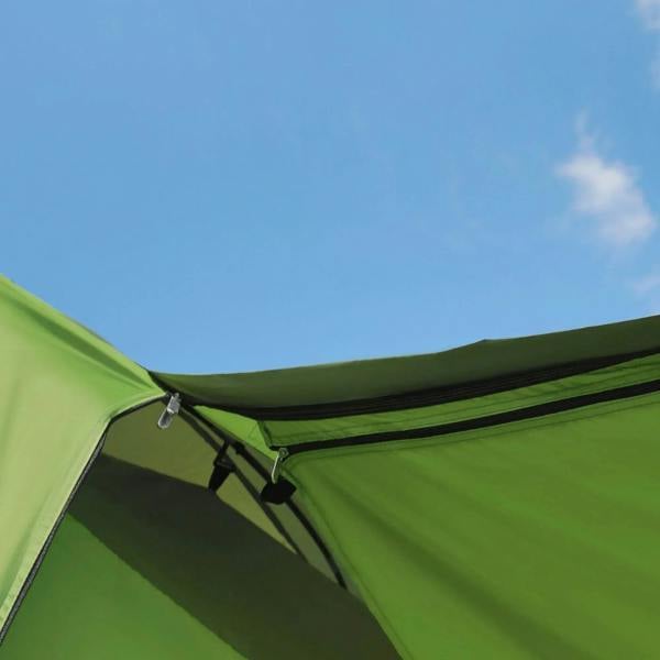 Green tent inner wall with zippered cover along the arched roof edge