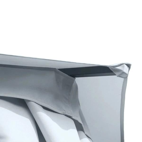 Close-up of grey hexagon gazebo canopy seam and hanging curtain edge at the roof corner