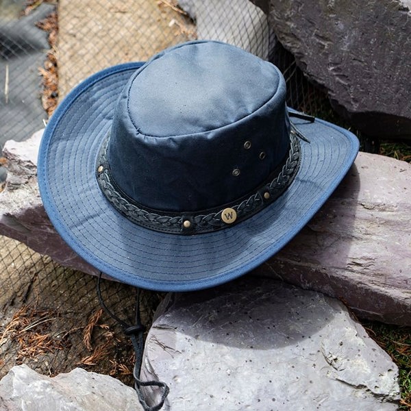 The wilderness navy waxed cotton unisex hat by Wombat