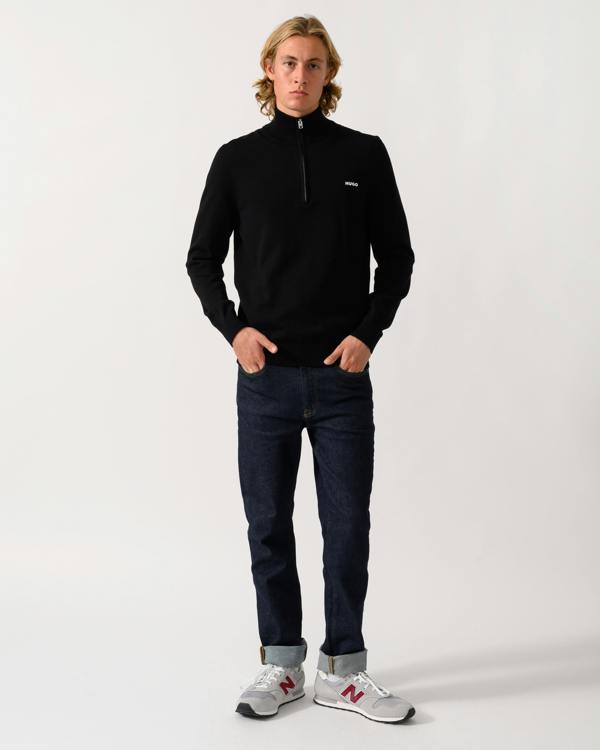 full length of a model wearing a HUGO San Quintus-C2 Mens 1/4 Zip Funnel Neck Jumper in Black 001