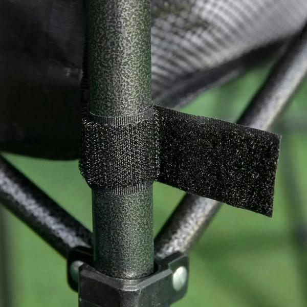 Close-up of black table leg joint and protective sleeve on folding camping table.