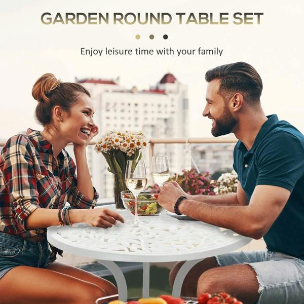White round bistro table with two ornate chairs for outdoor dining