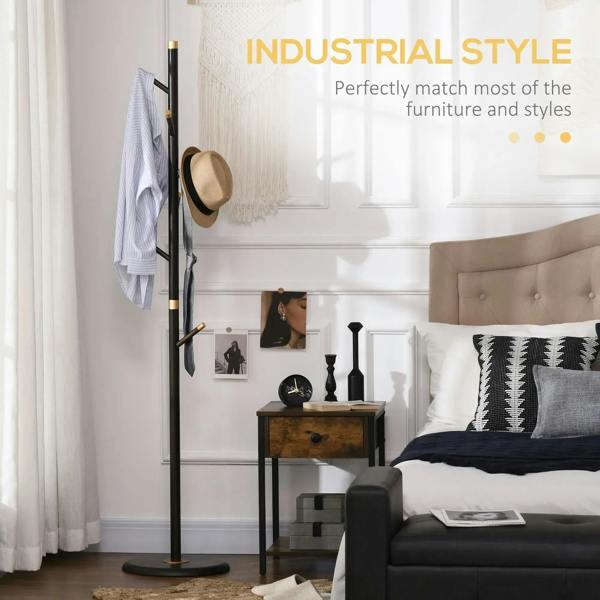 Freestanding coat rack stand with dark frame, gold bands, round base, and hanging coat