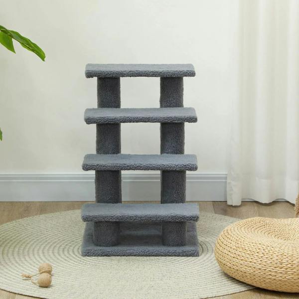Grey 4-step pet stairs standing on a rug with four padded levels and posts
