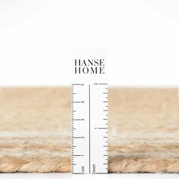 Textured beige fabric with a ruler for scale and 'HANSE HOME' branding.