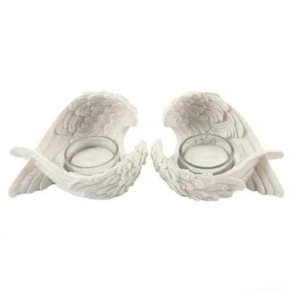 Set of 2 winged candle holders with white resin wings and two round candle cups