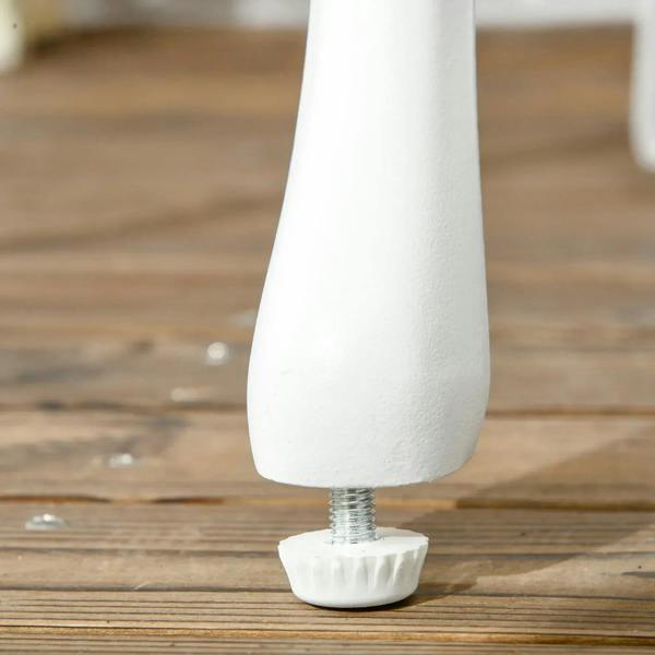 Close-up of white table leg with adjustable foot for level outdoor placement