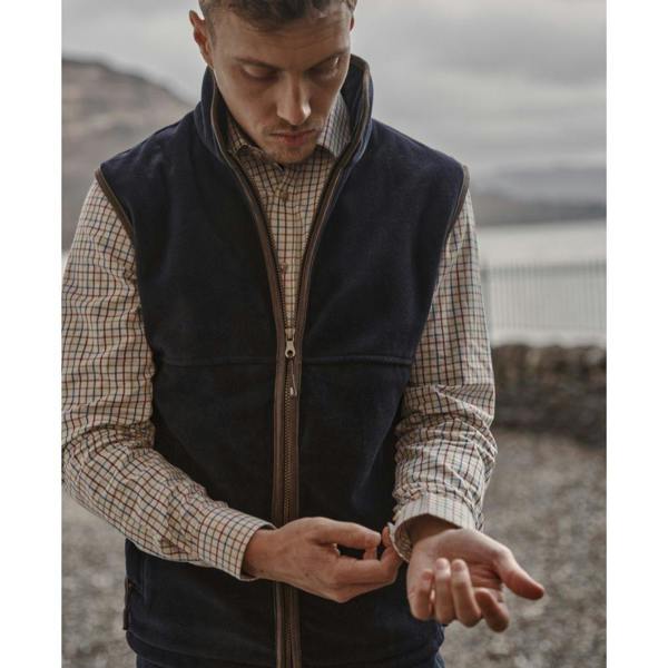 Man wearing Hoggs of Fife Inverness Tattersall shirt layered under Stenton fleece gilet, styled for farm work or country walks