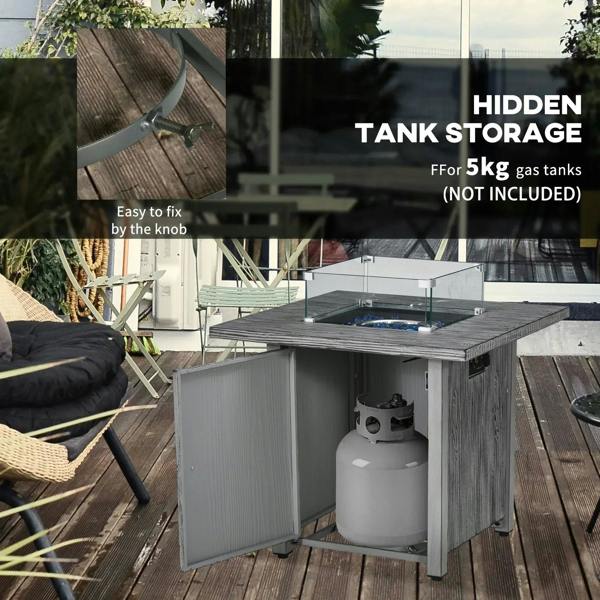 Grey gas fire pit table with side tank storage door open, glass screen on top