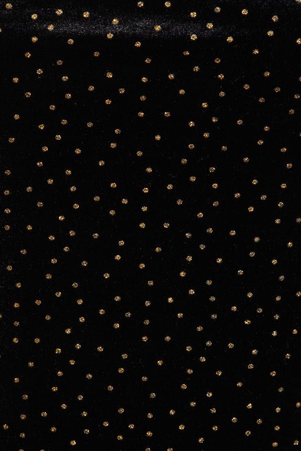 a Sarvin Gold Polka Dot Dress fabric.