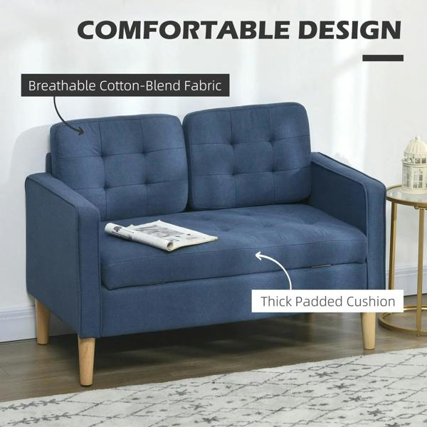 Blue tufted loveseat sofa with thick padded seat and back cushions
