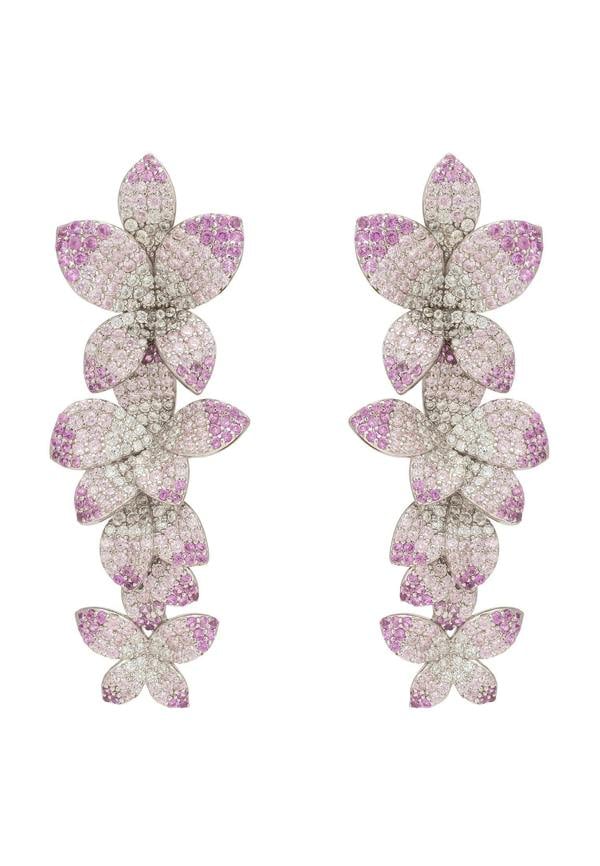 Orchid-shaped earrings with pink and purple gemstones on a white background