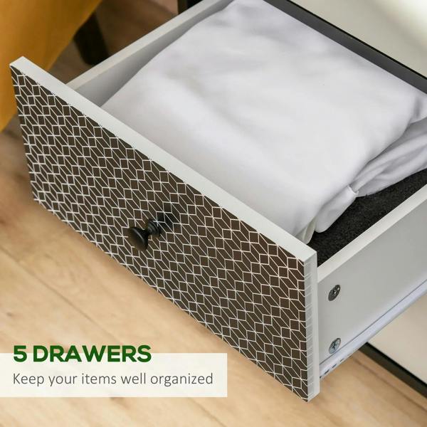 Black dresser with patterned drawer front, round knob, and open drawer with white interior