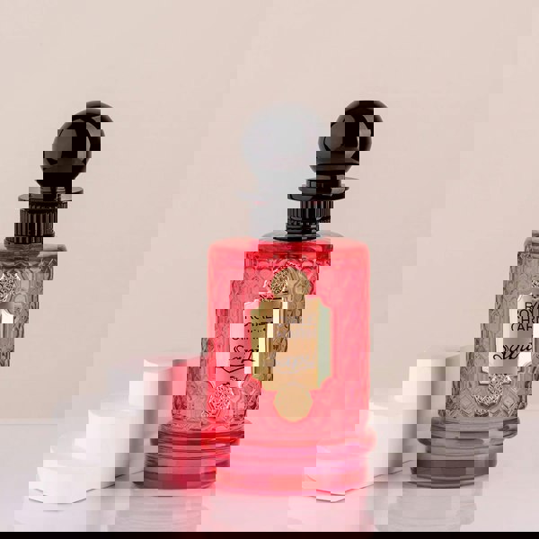 Sapil Royale Charm Eau de Parfum 100ml featured with lemon on light pink background