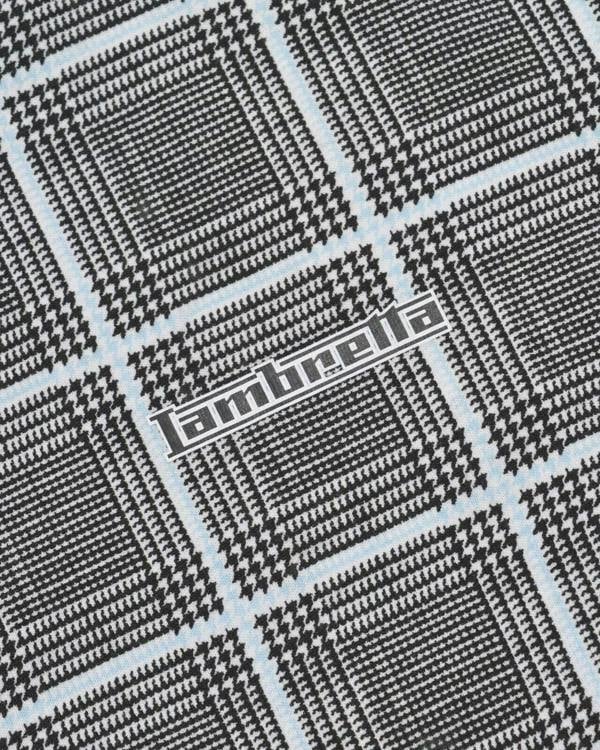 Lambretta Mens Prince of Wales Check Mod Ska Casual Polo, black and white checkered pattern with blue lines and Lambretta logo.